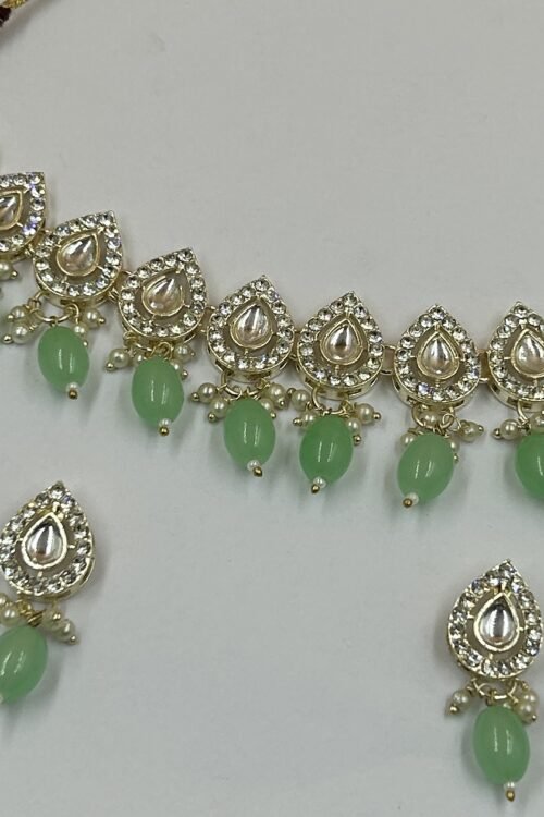 New dedicated Necklace set with pairs of earrings and beautiful maangtika white kundan and mint green beads